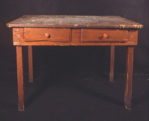 Mahogany-stained table with round pulls on drawers