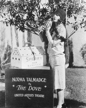 Norma Talmadge (?) holding a carrier pigeon from Sperry Air Service