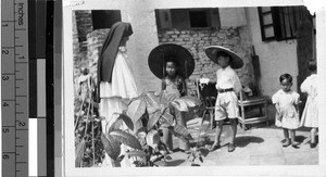 Maryknoll Sister Dolorosa visiting with children, Wuchow, China, May 1948