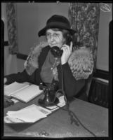 Nellie Brewer Pierce, Republican convention delegate, answers the telephone, Los Angeles, 1936