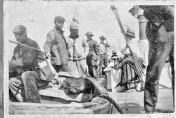 Bill Smith and other men and women on a large boat at Bodega Bay, 1890s