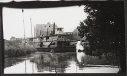 Steamer Petaluma navigating the Petaluma River near the McNear warehouse