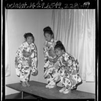 Three Japanese American girls in kimonos dancing at Japanese Children's Day, Los Angeles, Calif., 1963