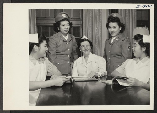 Miss Florence M. Clarke, Director of Nursing, talks with Nisei girls enrolled in the Cadet Nurse Training Corps at Kansas