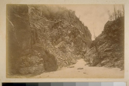 [Train on a steep ledge over the Athabasca River]