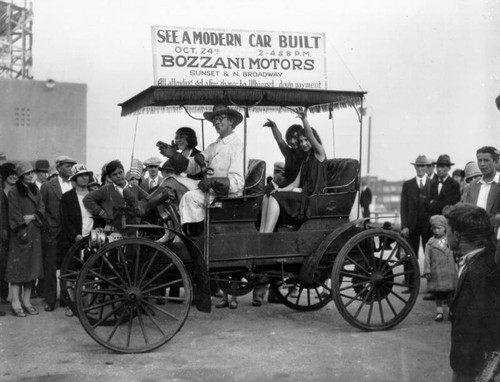 Family in antique car parade