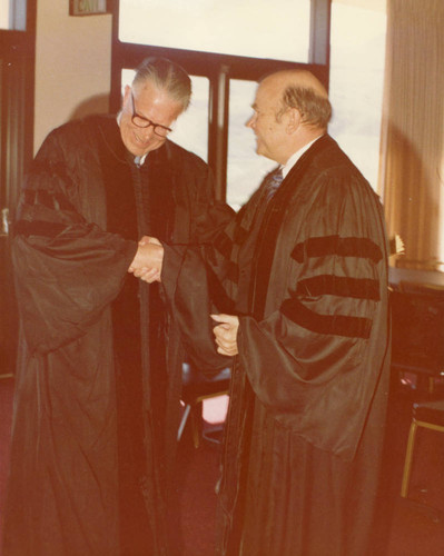 Chancellor Young in the robe room with Roger Gunder