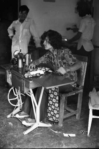 Man operating a sewing machine, La Chamba, Colombia, 1975