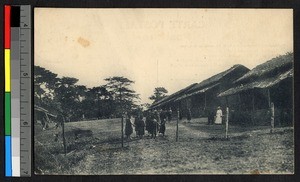 People standing outside of a thatched mission building, Congo, ca.1920-1940