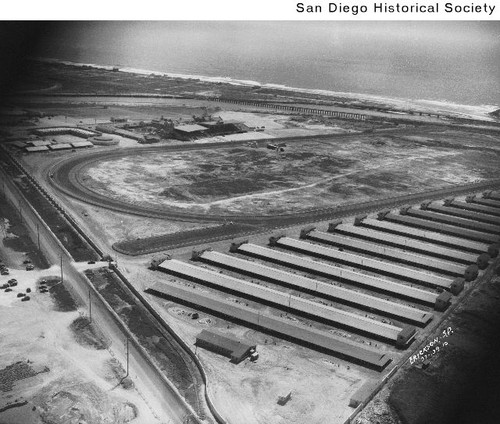 Aerial view of the grandstand, buildings, stables, and racetrack at Del Mar