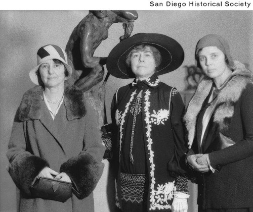 Mary Marston, Mrs. Leon Durand Bonnet, and Mrs. Reginald Poland standing in front of a sculpture