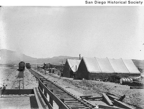 San Diego-Arizona Eastern Railroad construction camp showing two large tents and supplies
