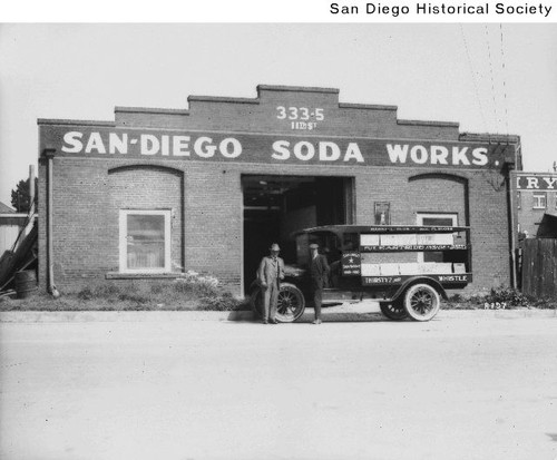 Two men and truck in front of the San Diego Soda Works at 333 Eleventh Avenue