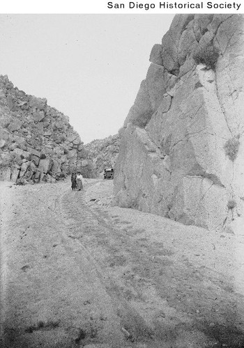 Two women in front of an automobile on the Mountain Springs Grade road ...