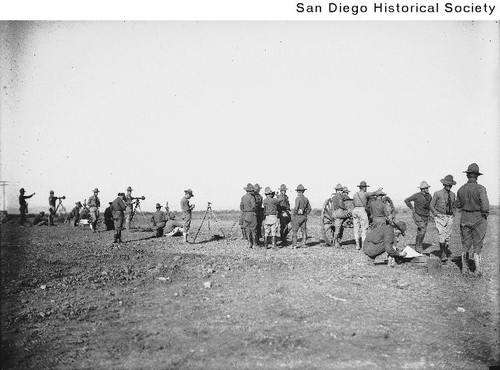 Soldiers surveying during a break in artillery practice