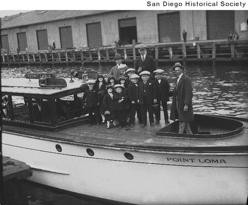 A group of people, including midgets aboard the Star & Crescent boat Point Loma