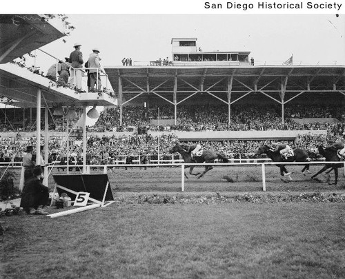 Race horses crossing the finish line at the opening day of the Del Mar Racetrack