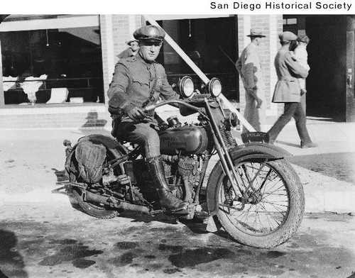 Officer Dean Bentner seated on his police motorcycle