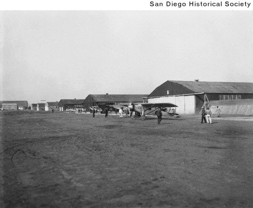 Spirit of St. Louis with its engine running while parked outside a hangar