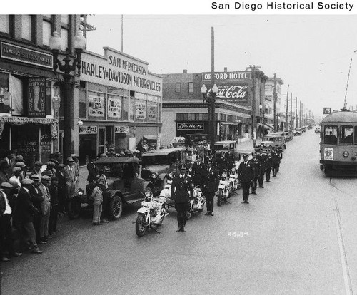 Mexican motorcycle police officers standing in front of Sam McPherson's Harley-Davidson motorcycle shop