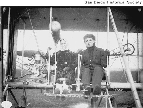 Farnum Fish and an unidentified woman seated in an early airplane