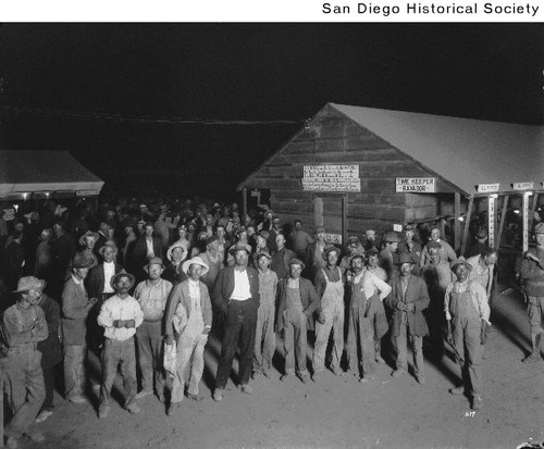 Group of men at Camp Kearny standing around the paymaster's hut