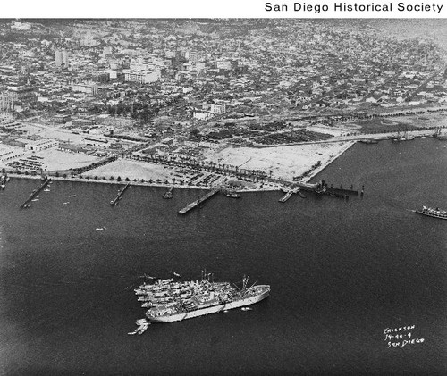 Aerial view of ships tied together in San Diego Bay, looking northeast over downtown San Diego