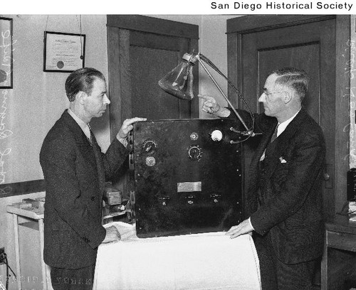Royal Raymond Rife and Philip Hoyland standing on opposite sides of a ...