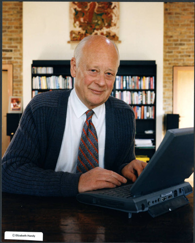 Charles Handy, color photo with laptop