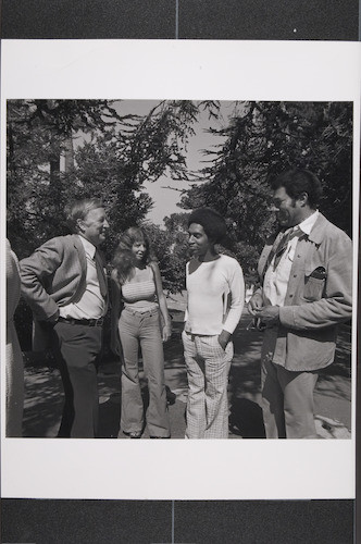 John Streetz and Harry Ford with two students