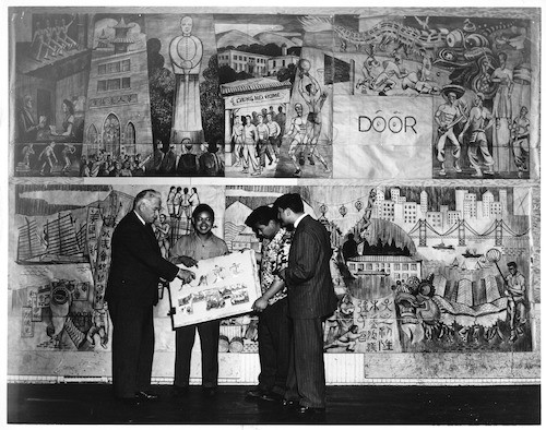 Spencer Macky with Chinatown murals