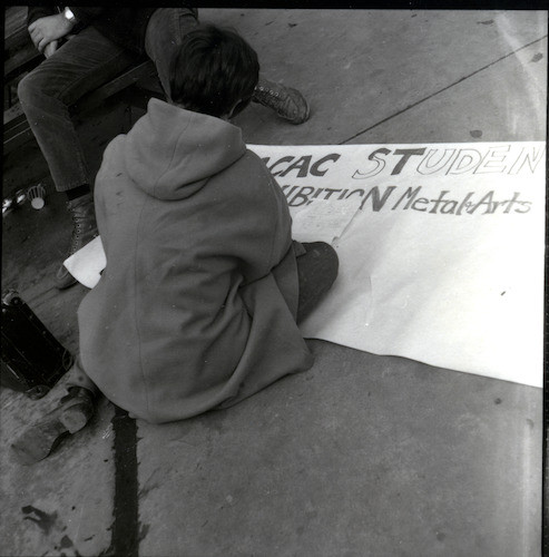 Student making sign for CCAC Students Metal Art Exhibition — Calisphere