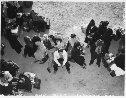 Japanese-Americans awaiting buses to Manzanar, April 1, 1941