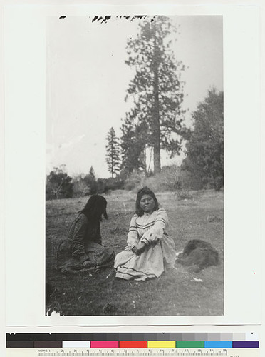 Two Mono women sitting on ground