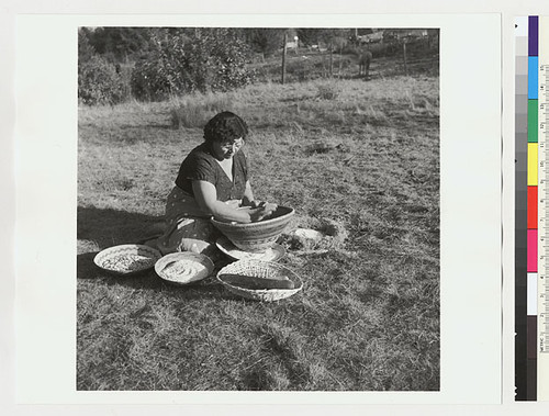 Essie Parrish preparing acorn meal