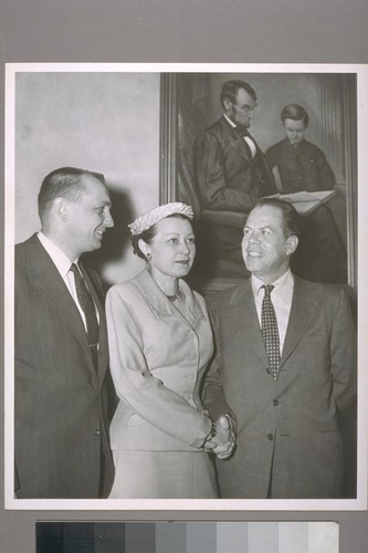 Mrs. Faye Harman, new Head of Federal Housing Administration's San Diego Insuring Office is congratulated by Representative Bob Wilson of San Diego and Senator Thomas H. Kuchel of California following appointment to highest F.H.A. post ever given a woman