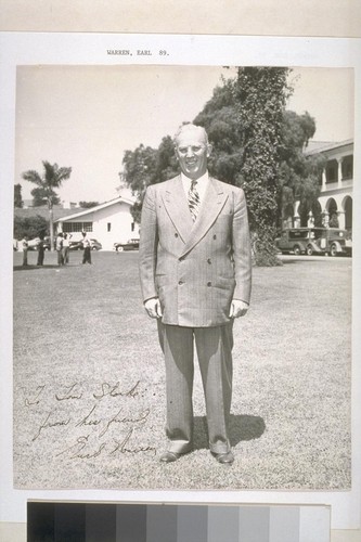 [Earl Warren standing outside.]