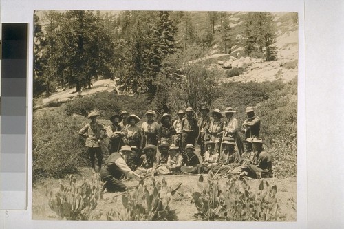 [John Muir giving a talk to a group of people outdoors