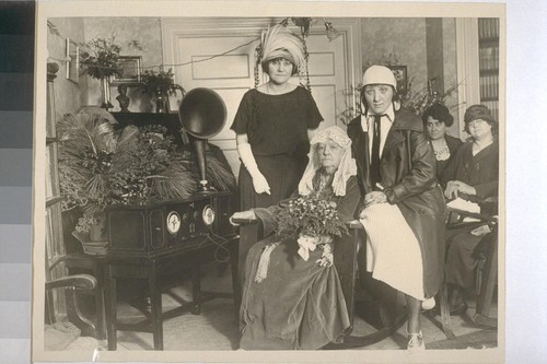 Miss [Ina Donna] Coolbrith with Mrs. Verneille de Wittwer (?), Aviatrix Lillian Gatlin (who flew to the Mother Lode Country for branches), Mrs. Genevieve Newmark and unknown woman at birthday celebration for Ina