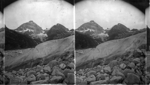 Snout of the Great Glacier - Mt. Sir Donald Towering above lt. Glacier, B.C., Can. Glacier