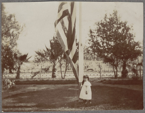 Front garden of Captain Merithew home including Carol Dunbar, age 3, 1897