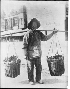Portrait of a Chinese truck gardener peddling goods, ca.1920