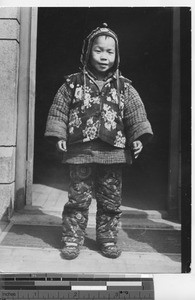 A boy dressed in warm clothing at Fushun, China, 1939