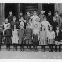 Exterior view of Washington School students posing on the steps of the school