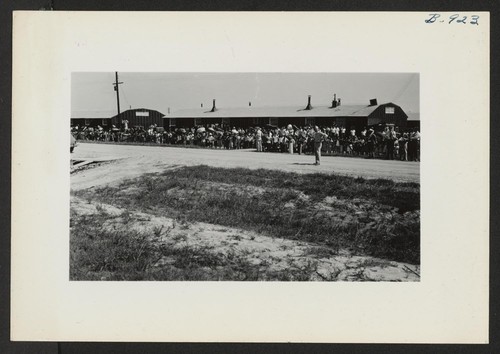 Typical crowd in front of Warehouse 12 watching the departure of the segregation train. Photographer: Lynn, Charles R. Dermott, Arkansas