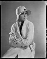 Peggy Hamilton modeling a Beaudine Hat with a sports ensemble in white angora wool, 1931