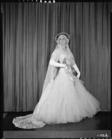 Peggy Hamilton modeling an Earl Luck wedding dress, 1931