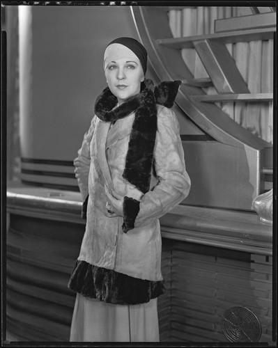 Actress (?) modeling a fur coat, circa 1931-1933