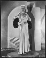 Peggy Hamilton modeling a Max Rée gown in ivory and black satin, 1931