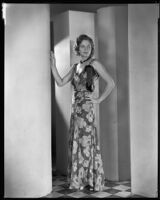 Actress Natalie Kingston modeling an evening gown from a Walter Switzer shop, 1930